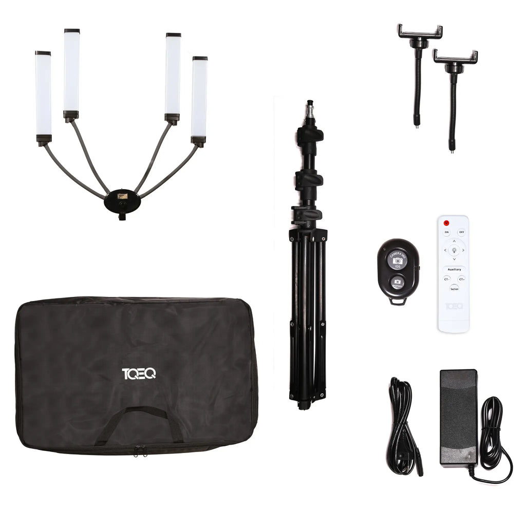 Collection of photography equipment: MUA Key Light including light stands, remote controls, and carrying case on a white background. TQEQ